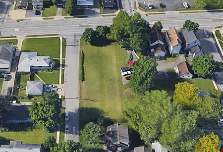 A look at Two (2) Double Houses plus Vacant Land Commercial space for Sale in Depew